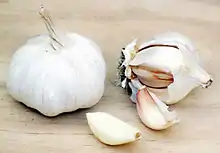 Two bulbs of garlic on a table