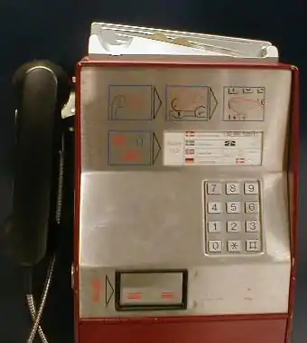 Payphone with slide for coins