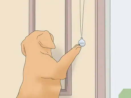 Image titled Potty Train Your Puppy Using a Bell Step 14