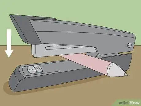 Image titled Fix a Jammed Manual Stapler Step 1