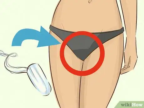 Image titled Use a Tampon While Swimming Step 1