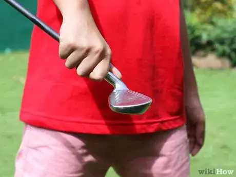 Image titled Juggle a Golf Ball on a Golf Club Step 1