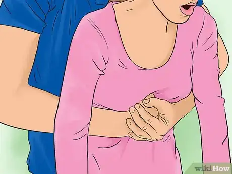 Image titled Perform the Heimlich Maneuver Step 4