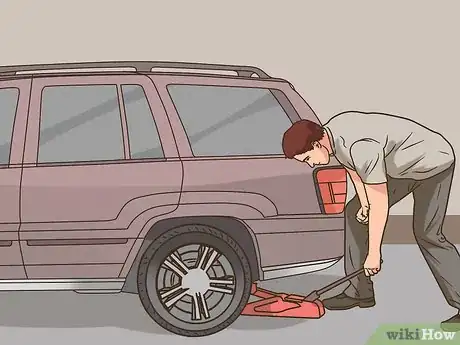 Image titled Change a Tire on a 1999‐2004 Jeep Grand Cherokee (WJ) Step 15