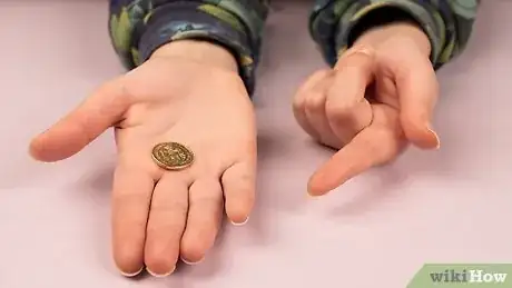 Image titled Do a Simple Coin Magic Trick Step 6