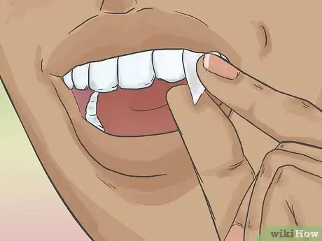 Image titled Apply Vampire Fangs Without Glue Step 4