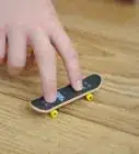 Ollie on a Tech Deck Using Three Fingers