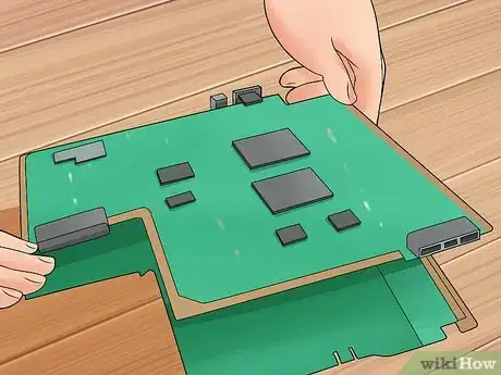 Image titled Disassemble a PS3 Fat to Clean Step 10