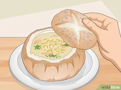 Image titled Eat Soup Served in a Bread Bowl Step 1