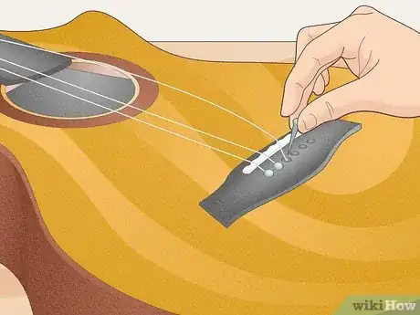 Image titled Fix a Guitar Bridge Step 2