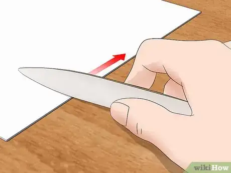 Image titled Use a Bone Folder Step 4