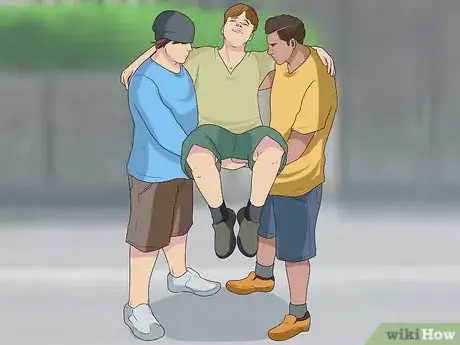 Image titled Carry an Injured Person Using Two People Step 12