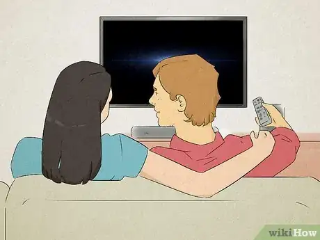 Image titled Man turning off the television to talk to his girlfriend.