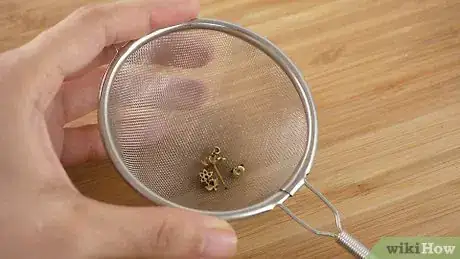 Image titled Clean Gold Earrings Step 1