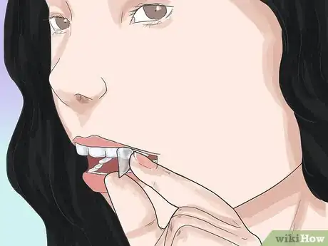 Image titled Apply Vampire Fangs Without Glue Step 10