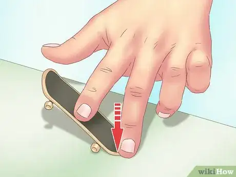 Image titled Kickflip on a Tech Deck Step 3