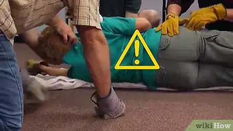 Image titled Logroll an Injured Person During First Aid Step 11