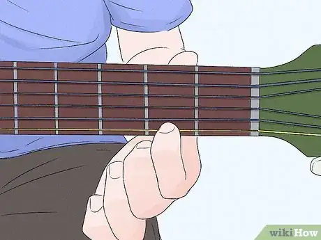 Image titled Play a Bm Chord on Guitar Step 1