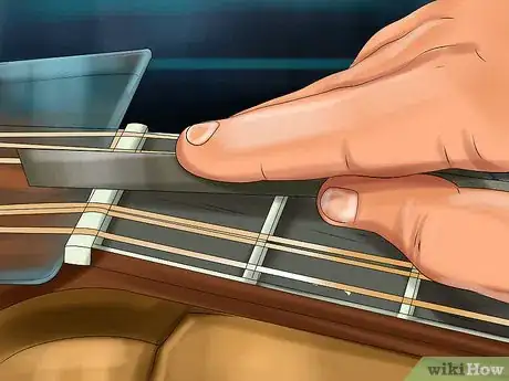 Image titled Lower the Action on an Acoustic Guitar Step 11