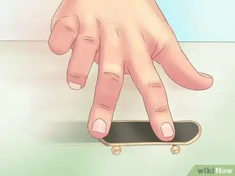 Image titled Kickflip on a Tech Deck Step 12