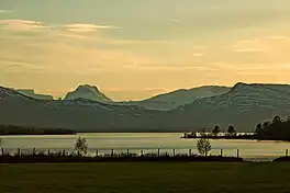 A lake with high mountains beyond