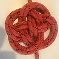 Chinese button knot Doubled ABOK #601 flat, with one end from outside all the way, ends passing each other before reversing