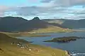 View over the bay of Tjaldavík, Øravík and Trongisvágur. A part of Øravík is visible just below the mountain Oyrnafjall.