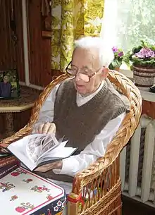 Viktor Bokov flipping through a book