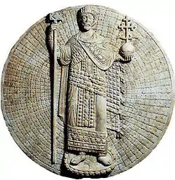 John II Komnenos. Although the relief is anachronistic and the emperor wears simultaneously both the loros and the chlamys (the coat on top), something which was never the practice, the wrapping of the loros beneath is carved accurately, 1143 AD.