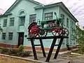 Monument to labor glory - "Universal" tractor, Bakhmutskyi district, Bakhmutskyi district, Siverska district, Siversk city