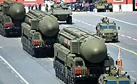 RS-24s escorted by GAZ Tigrs and Bumerang APCs behind them