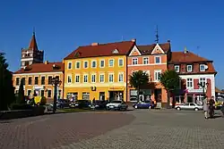 Old houses at the main square with St. George church in the background