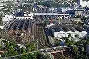 On the left is a suburban rail, further back is the main station