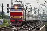 Electric locomotive Skoda CHS2T-1044 with passager train in Kolpino