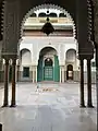 A view of one of the ṣoḥoon framed by an archway.