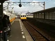 A Kotoden 1200 series arriving at Takinomiya