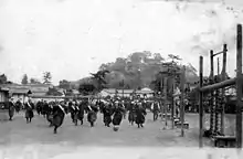 Image 3Japanese high-school girls playing football in their traditional hakama with one team wearing sashes (c. 1920) (from Women's association football)