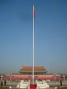 PRC flag flying in the middle of Tiananmen Square.