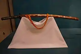 Katana style sword mounting with hollyhocks design crests in maki-e lacquer and mother of pearl inlay on ikakeji lacuer ground. Edo period, 19th century.