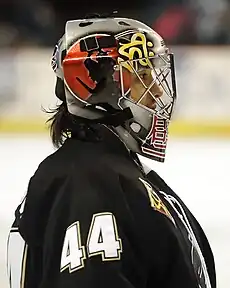 Ice hockey goaltender standing up looking to the right