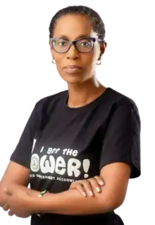 photograph of woman with short hair and glasses, crossed arms