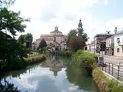 The bell tower of the Church of Saints Gervasio and Protasio visible form Via Italia in Gorgonzola.