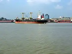 Cargo ships on the shores of Yangon River, just offshore of Downtown Yangon.