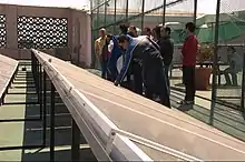 Image 14Participants in a workshop on sustainable development inspect solar panels at Monterrey Institute of Technology and Higher Education, Mexico City on top of a building on campus. (from Solar energy)