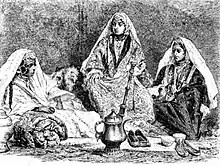 1919 drawing of Kashmiri Pandit women wearing intricately decorated pherans