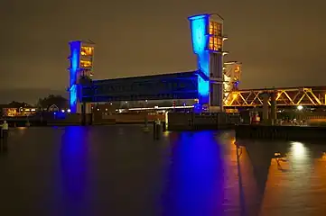 The towers lit in blue, indicating that the barrier is open