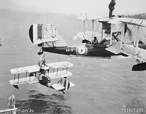 Two Supermarine Seagull III seaplanes of No. 101 Flight being hoisted onto HMAS Albatross