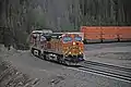 An eastbound BNSF intermodal train cresting the summit of the pass