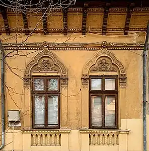 Romanian Revival windows with mascarons at the top, on the facade of Strada Polonă no. 13, Bucharest, unknown architect, c.1900