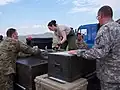 Alaska Air National Guard members loading cargo pallets at Chinggis Khaan International Airport during Khaan Quest 2018